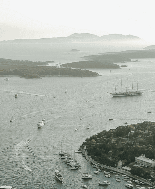 Aerial view of Adriatic islands with sailing boats and yachts at anchor